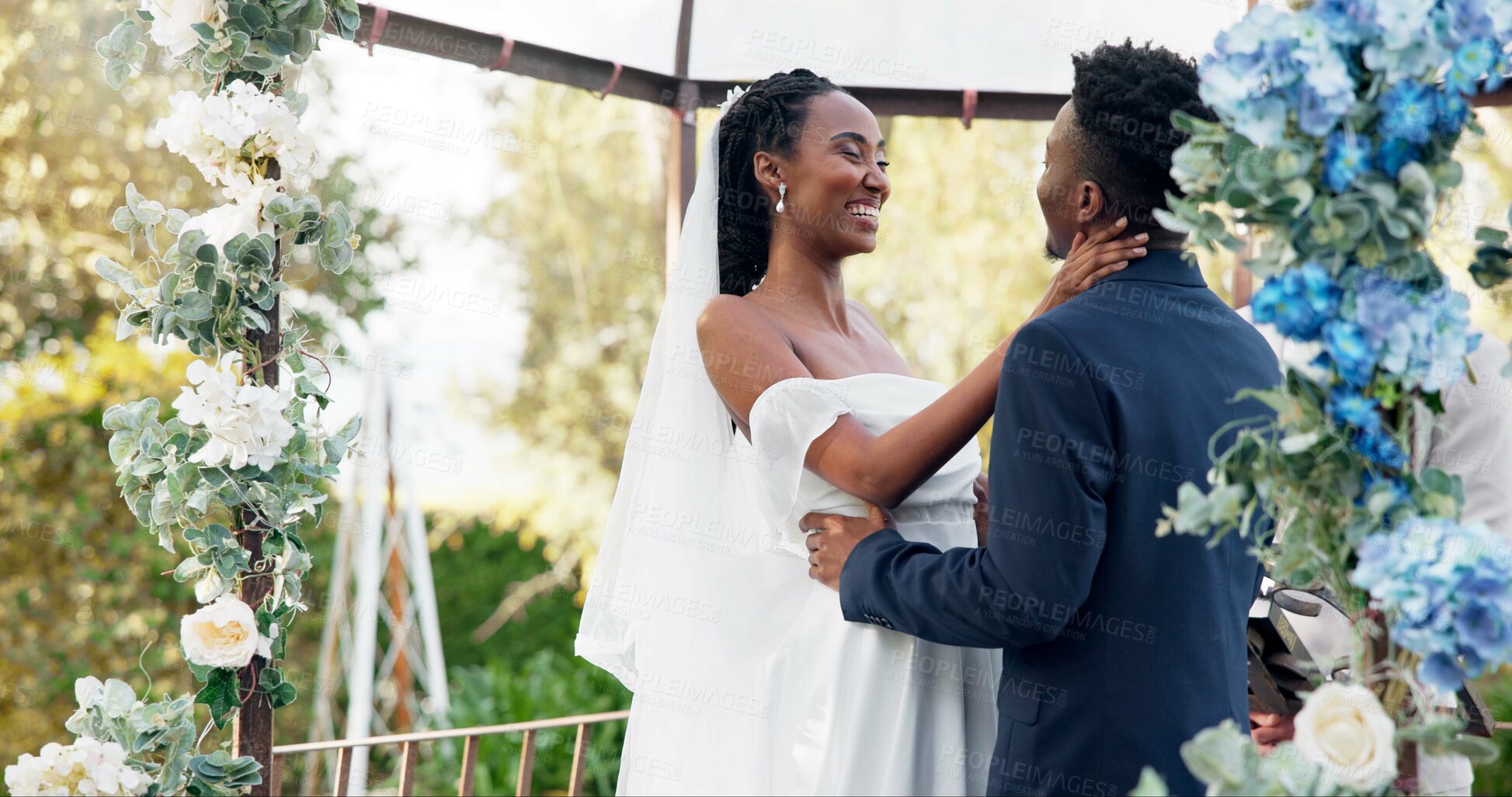 Buy stock photo Happy black couple, wedding and kiss for love, marriage or commitment in support together. Married African woman and man kissing in embrace, trust or relationship of bride or groom in outdoor romance