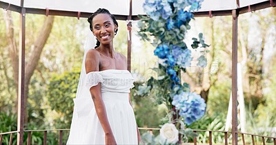 Woman, portrait and bride at wedding reception, flowers and smiling with happiness, joy and dress. Marriage, outdoor and fashion model for bridal outfit, venue and commitment ceremony celebration