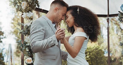 Couple, wedding and dancing with touch, outdoor and commitment in celebration, love and smile. Interracial marriage, fashion and happy in nature, peace and romance of union and trust