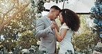 Love, dance and couple at wedding for commitment and in celebration at a outdoor marriage ceremony or event for trust. Husband, wife and happy woman or bride with smile and care for partner together