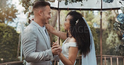Couple, wedding and dancing with touch, smile and commitment in celebration. Interracial marriage, fashion and happy in outdoor, love and romance in conversation, trust and vertical in nature or cute
