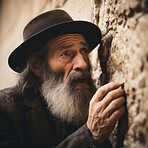 Senior jewish man praying at western wall. Sacred, faith full ritual. Religion concept.