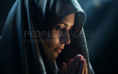 Close up face of middle eastern woman praying in church. Religion concept.