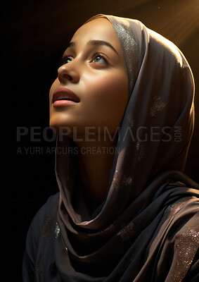 Buy stock photo Young muslim woman lifting her head in prayer. Sunlight on her face. Religion concept.