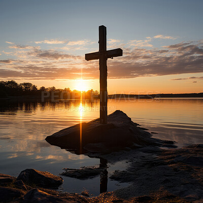 Silhouette of christian cross on a lake. Sunset, golden hour. Religion concept.