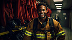 Portrait of black firefighter standing in locker room. Search and rescue safety concept