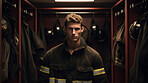 Portrait of young firefighter standing in locker room. Search and rescue safety concept