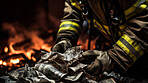 Firefighter hands taking money from pile with fire in background. Bribery payment concept