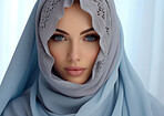 Close up of portrait of muslim woman wearing traditional head scarf. Religion concept.