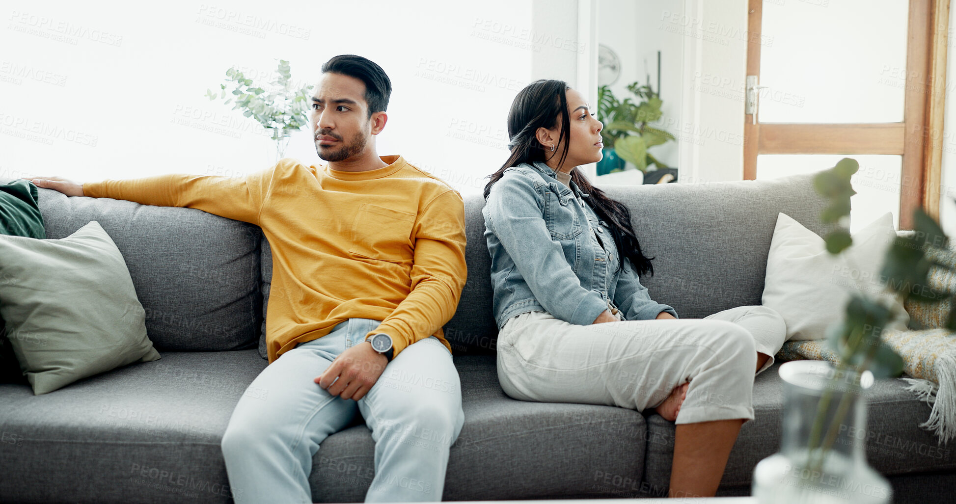 Buy stock photo Conflict, fight and couple frustrated on a couch together with drama, argument and relationship in a home. Angry, divorce and man with marriage problem with woman and stress on a living room sofa