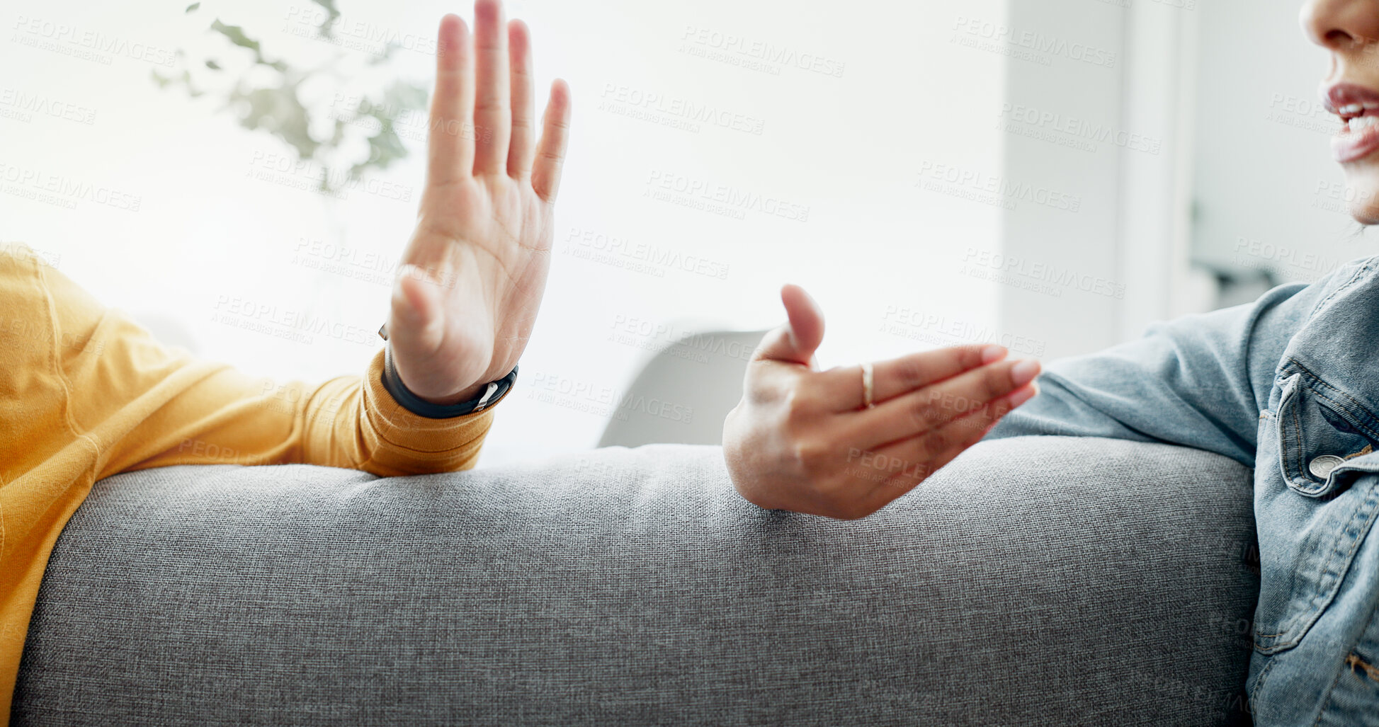 Buy stock photo Argument, hands and closeup of couple on a sofa in the living room for cheating, fight or toxic relationship. Conversation, discussion and zoom of man and woman talking for communication at home.