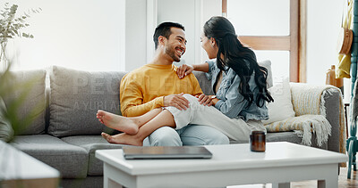 Buy stock photo Couple, happy and talking on home sofa with a smile, security and love in healthy relationship. Young man and woman together in living room for affection, forehead touch and communication with care