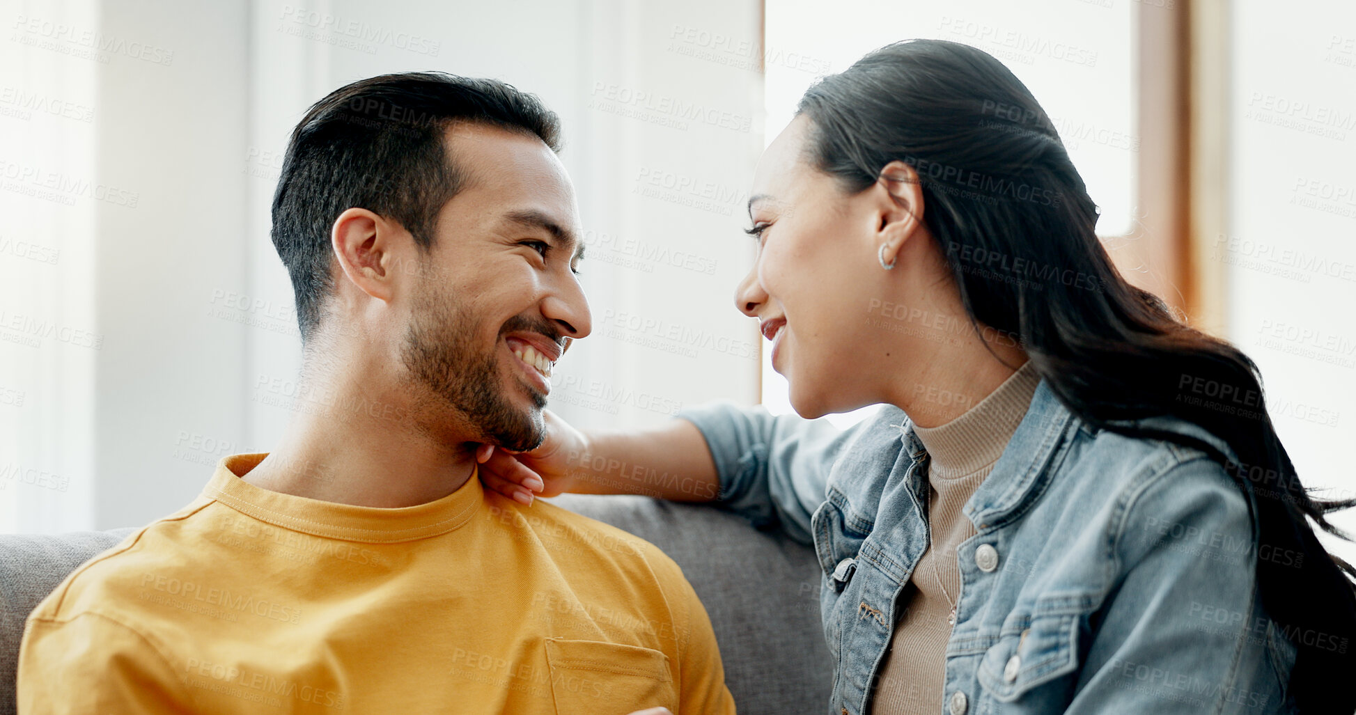 Buy stock photo Conversation, love and happy couple on sofa, relax and bonding in romantic discussion in home. Smile, man and woman in living room with trust, support and respect in marriage together in apartment.