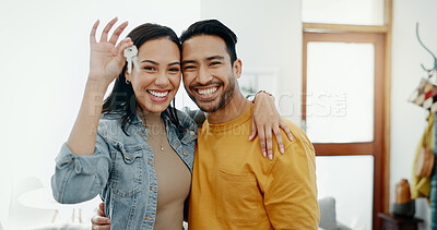 Buy stock photo New home keys, hug and portrait of happy couple moving into house, real estate property or apartment purchase. Love, homeowner smile and Mexican man, woman or relocation people embrace in living room