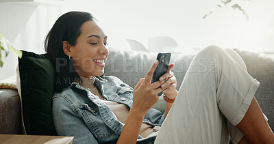 Buy stock photo Woman, phone texting and home with social media post, networking and online on a sofa. Mobile app, happy message and typing on a living room couch with digital entertainment and tech in a house