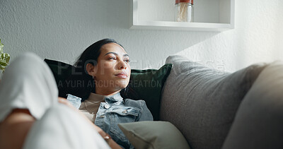 Buy stock photo Woman, thinking and typing on smartphone on sofa, scroll social media and reading notification at home. Cellphone, relax and search connection, download digital app and mobile contact in living room