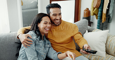 Buy stock photo Couple, smile and watch movies on tv, news and cable show for media broadcast on sofa at home. Happy man, woman and people change television remote for streaming multimedia, subscription and comedy
