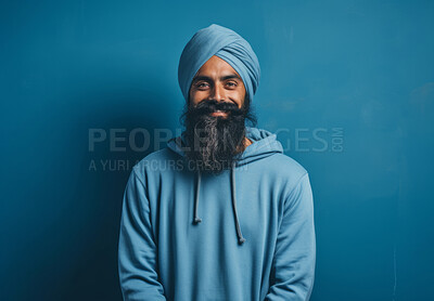 Buy stock photo Indian man wearing traditional blue turban with hoodie. Studio portrait. Religion concept.