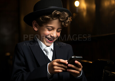 Buy stock photo Studio portrait of happy jewish kid using smartphone. Religion concept.