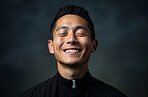 Portrait of asian priest smiling eyes closed. Against backdrop. Religion concept.