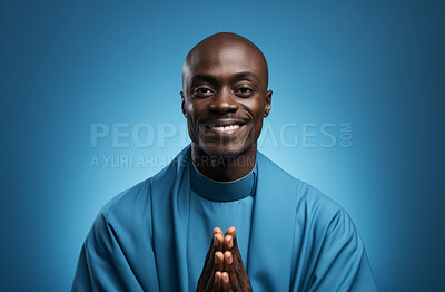 Buy stock photo Studio portrait of african priest against blue backdrop. Religion concept.