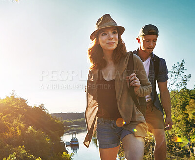 Buy stock photo Shot of a young couple out on an adventurous date in the mountains