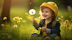 Boy with dandelions in a sunny flower meadow. Seasonal outdoor activities for children