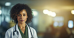 Portrait of female African American doctor standing in a hospital at night for night shift