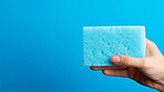Hand holding a sponge. Clean home and kitchen copyspace background