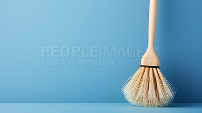 Wooden brush on blue. Clean home and kitchen copyspace background