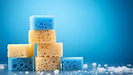 Stack of colorful sponges. Clean home and kitchen copyspace background