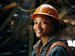 Construction worker woman standing in factory. Happy at work. Empowerment concept.