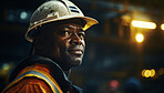 Candid shot of African American worker at work on construction site.
