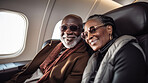 Mature couple on first class private jet. Luxury vacation travel concept.