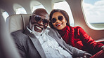 Mature couple on first class private jet. Luxury vacation travel concept.