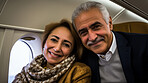 Mature couple on first class private jet. Luxury vacation travel concept.