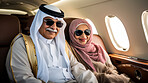 Mature couple on first class private jet. Luxury vacation travel concept.