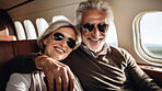 Mature couple on first class private jet. Luxury vacation travel concept.