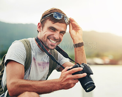 Buy stock photo Shot of a young man out with his camera