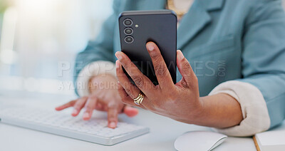 Computer keyboard, phone and business person hands typing online research report, copy mobile info or review. Closeup, smartphone data and professional employee working on cellphone application notes