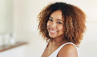 Buy stock photo Shot of an attractive young woman going through her morning routine
