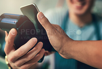 Buy stock photo Cropped shot of an unrecognizable barista taking a NFC payment