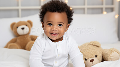 Buy stock photo Toddler smiling while sitting on bed with a toy. Portrait of a happy and cheerful baby