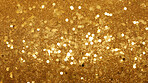 Gold glitter sparkling shiny wrapping paper background. Wallpaper decoration