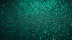 Green glitter sparkling shiny wrapping paper background. Wallpaper decoration