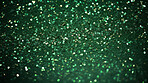 Green glitter sparkling shiny wrapping paper background. Wallpaper decoration