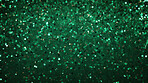 Green glitter sparkling shiny wrapping paper background. Wallpaper decoration