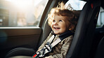 Toddler child sitting in car seat. Portrait of a child strapped in car seat for safety concept