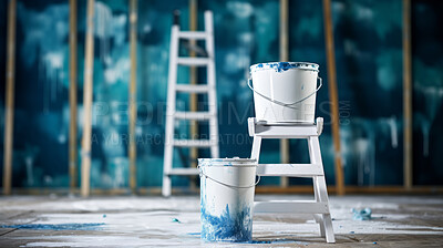 Opened paint bucket on stool. Ladder in background, diy construction concept.