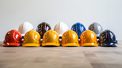 Studio shot of multi-colour hard hats on clear backdrop. Construction, labour day concept.